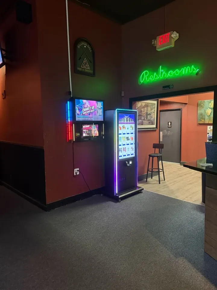 LED-lit vape tower in a pool hall
